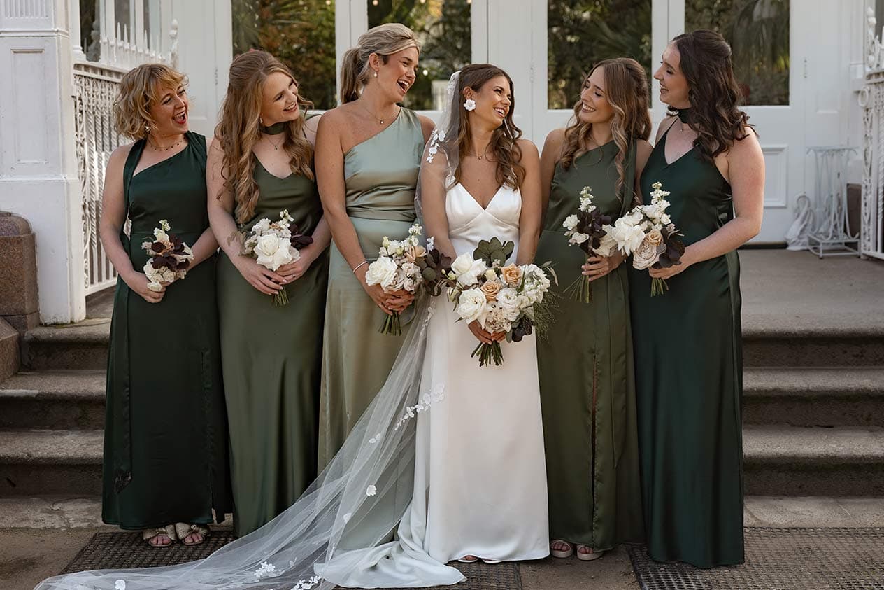 Bridesmaids in matching olive green dresses from Rewritten