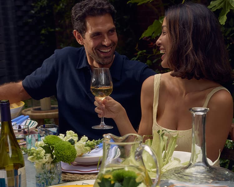 A couple celebrating with wine