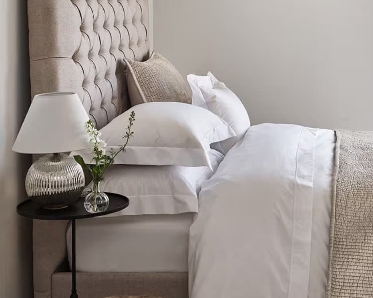 A bedroom featuring minimal homeware from The White Company