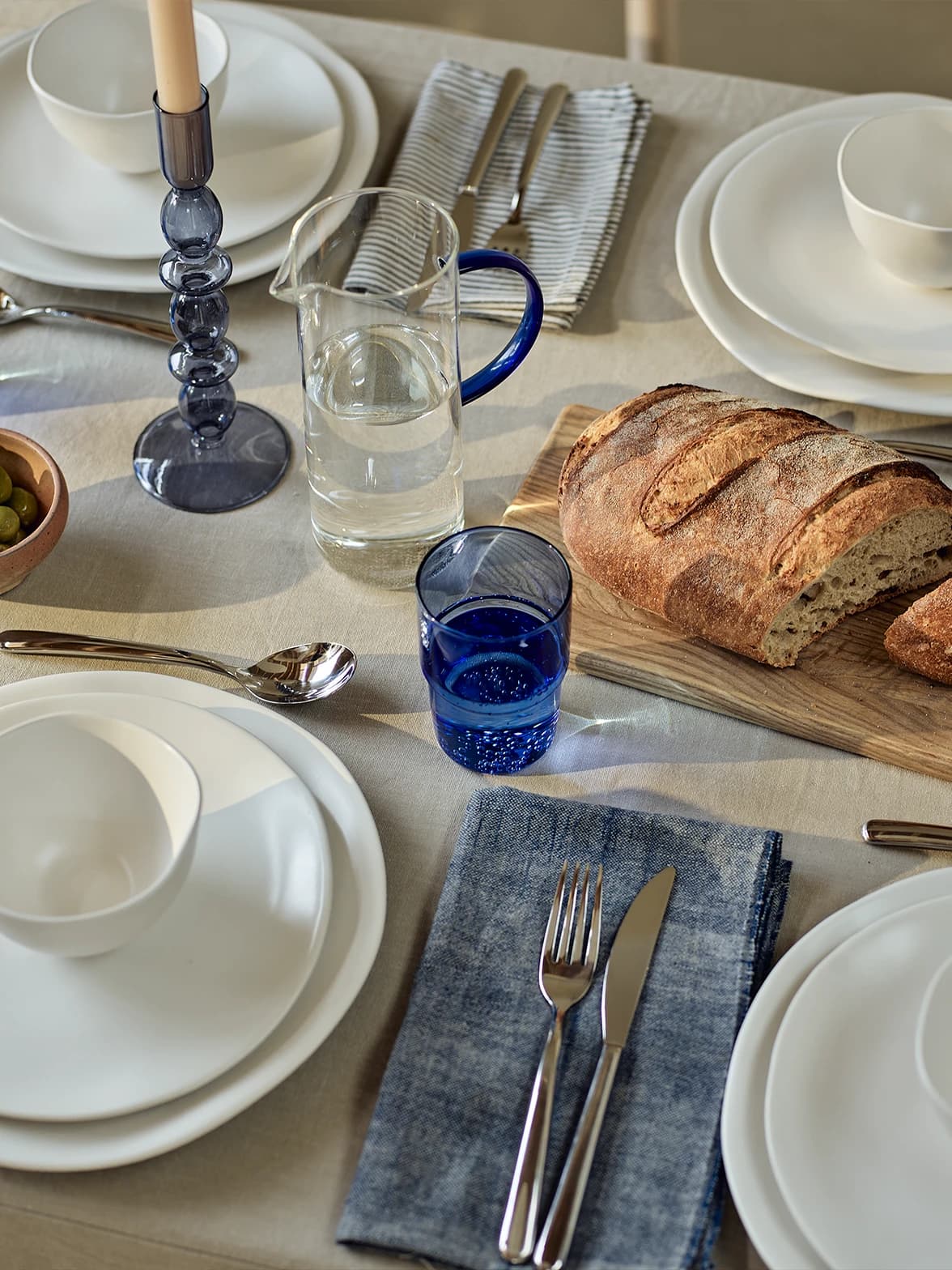 Blue and white tablescape featuring white crockery and blue details