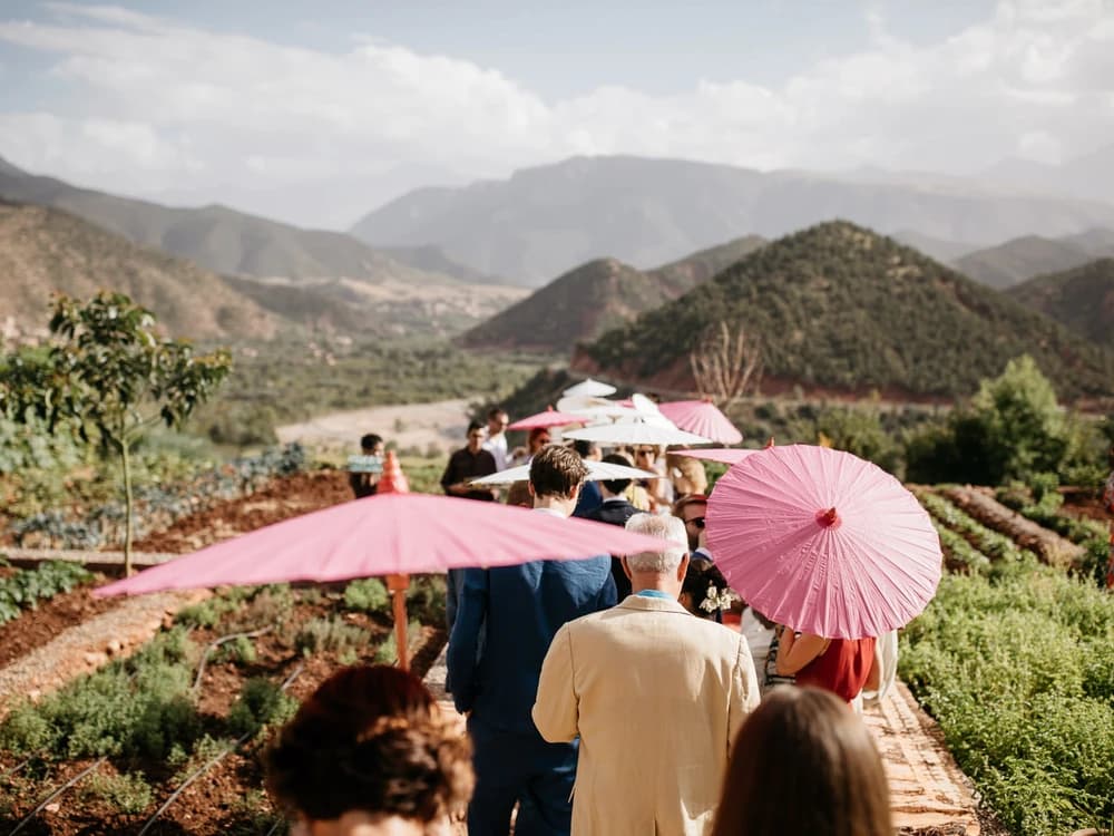 Wedding guests walk to the ceremony in Morocco