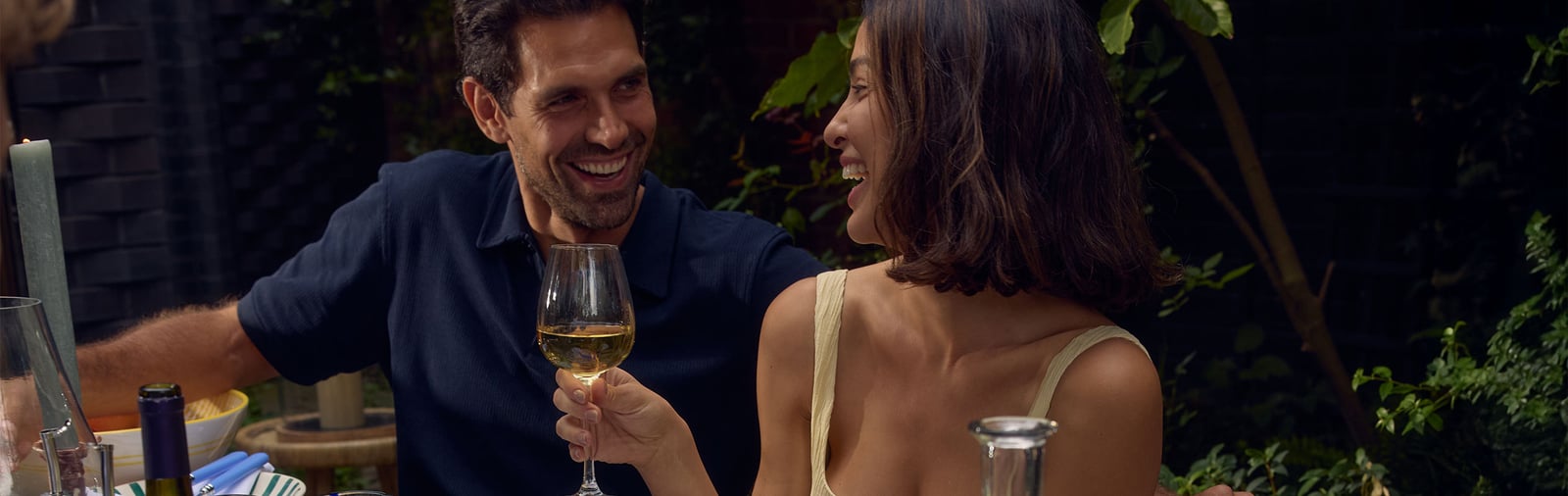 A couple celebrating with wine